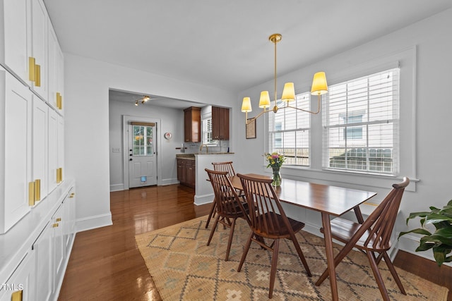 1116 E Martin St, Raleigh, NC 27610 - dining space featuring dark wood-style flooring and a chandelier
