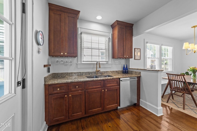 1116 E Martin St, Raleigh, NC 27610 - kitchen featuring stainless steel dishwasher, dark wood-style flooring, a chandelier, light stone counters, and recessed lighting