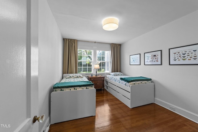 1116 E Martin St, Raleigh, NC 27610 - bedroom featuring dark wood-style floors