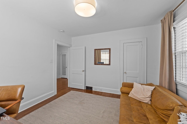 1116 E Martin St, Raleigh, NC 27610 - living area with wood finished floors and baseboards