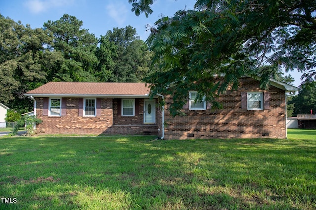 410 Sherron Rd, Durham, NC 27703 - view of front of home featuring a front lawn, brick siding, and crawl space