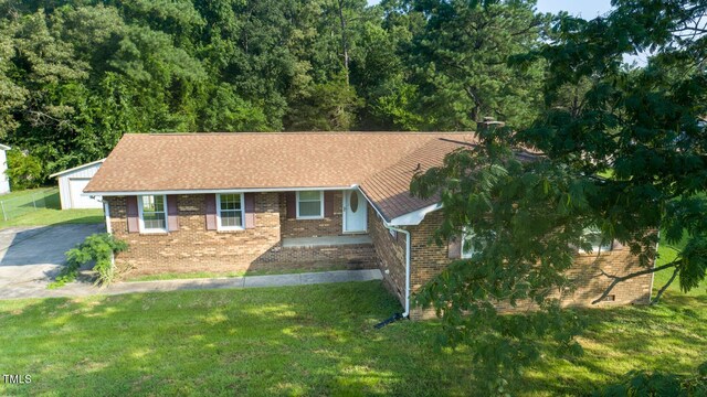 410 Sherron Rd, Durham, NC 27703 - ranch-style house with brick siding, a front lawn, and a garage