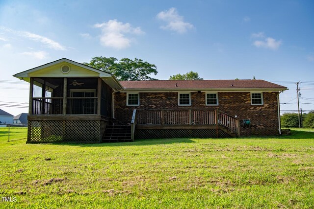 410 Sherron Rd, Durham, NC 27703 - rear view of house featuring a sunroom, stairs, a yard, and a wooden deck
