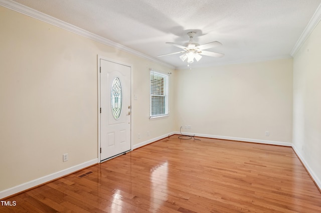 410 Sherron Rd, Durham, NC 27703 - entryway featuring ornamental molding, light wood finished floors, ceiling fan, and a textured ceiling