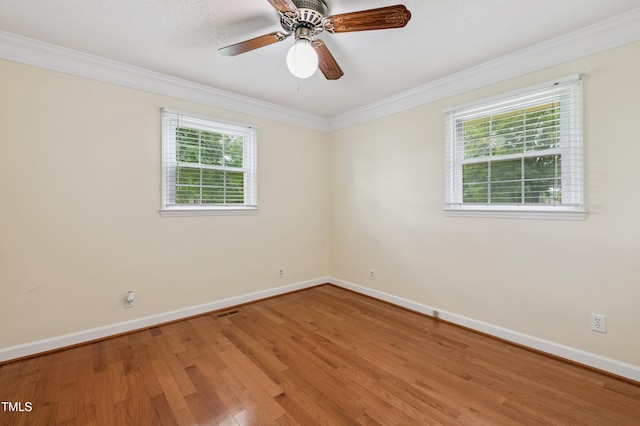 410 Sherron Rd, Durham, NC 27703 - empty room with ornamental molding, wood finished floors, and ceiling fan