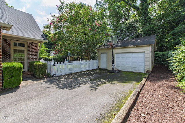 2328 Byrd St, Raleigh, NC 27608 - exterior space featuring an outbuilding, asphalt driveway, and a detached garage