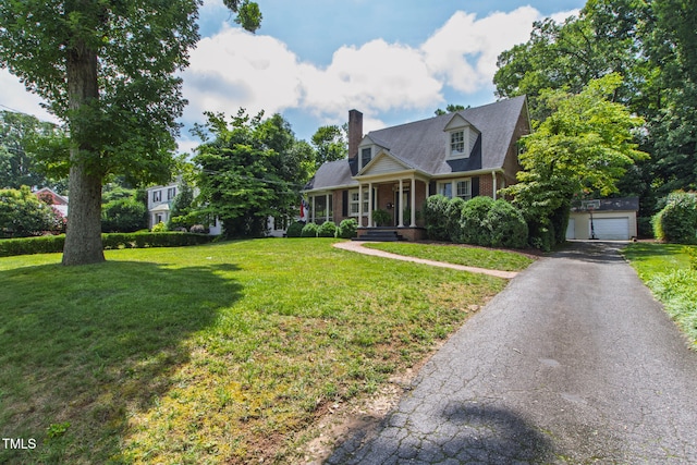 2328 Byrd St, Raleigh, NC 27608 - cape cod house featuring brick siding, asphalt driveway, a chimney, a front lawn, and a garage