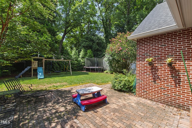 2328 Byrd St, Raleigh, NC 27608 - view of patio / terrace with a trampoline and a playground