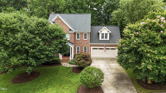 102 Glenmore Rd, Cary, NC 27519 - view of front of property with driveway, brick siding, an attached garage, a front yard, and a shingled roof