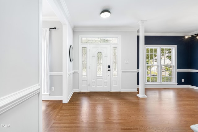 102 Glenmore Rd, Cary, NC 27519 - entryway with wood finished floors, decorative columns, and crown molding