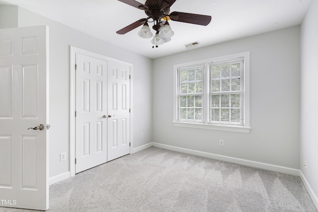 102 Glenmore Rd, Cary, NC 27519 - unfurnished bedroom featuring carpet flooring, a closet, and a ceiling fan