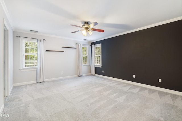 102 Glenmore Rd, Cary, NC 27519 - spare room with a ceiling fan, crown molding, and light colored carpet