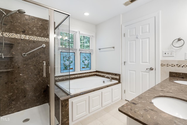 102 Glenmore Rd, Cary, NC 27519 - bathroom with a shower stall, a bath, double vanity, and tile patterned flooring