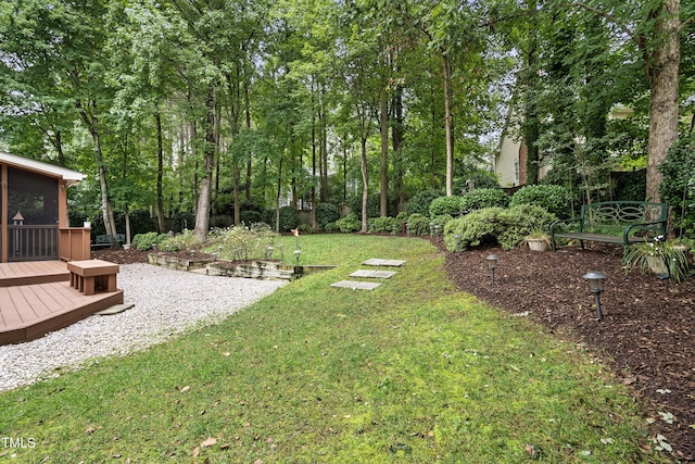 102 Glenmore Rd, Cary, NC 27519 - view of green lawn featuring a deck and view of scattered trees