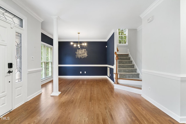 102 Glenmore Rd, Cary, NC 27519 - foyer featuring ornate columns, wood finished floors, plenty of natural light, crown molding, and stairway