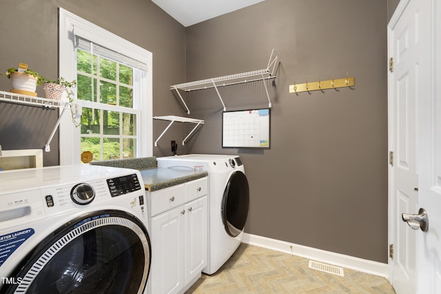 102 Glenmore Rd, Cary, NC 27519 - washroom with cabinet space and washing machine and clothes dryer