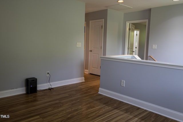 4921 Sweet Shade Trl, Raleigh, NC 27616 - empty room with dark wood-style floors and recessed lighting