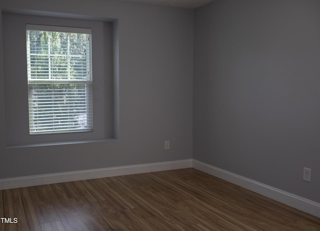 4921 Sweet Shade Trl, Raleigh, NC 27616 - spare room featuring wood finished floors and baseboards