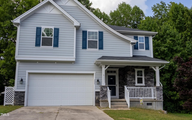 4921 Sweet Shade Trl, Raleigh, NC 27616 - view of front of home with stone siding, covered porch, concrete driveway, and an attached garage