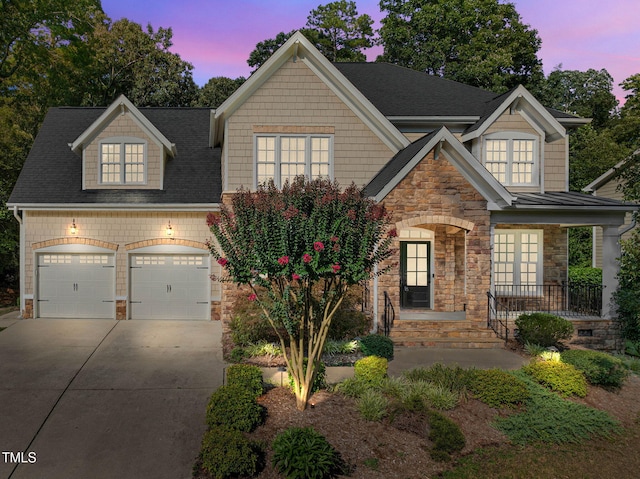 3005 Canopy Woods Dr, Apex, NC 27539 - craftsman-style home featuring stone siding, concrete driveway, covered porch, and roof with shingles