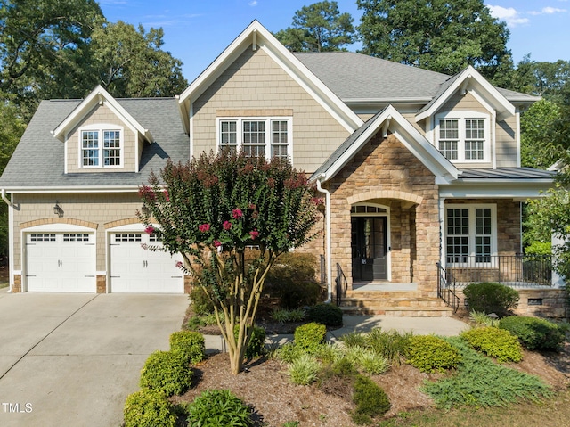 3005 Canopy Woods Dr, Apex, NC 27539 - craftsman-style house featuring stone siding, driveway, a porch, and a shingled roof
