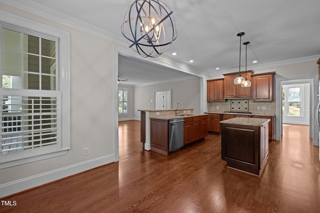 3005 Canopy Woods Dr, Apex, NC 27539 - kitchen featuring a center island with sink, stainless steel appliances, brown cabinetry, dark wood-style flooring, and backsplash