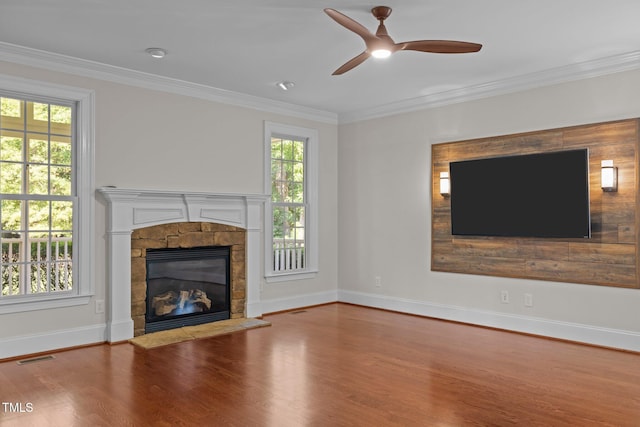 3005 Canopy Woods Dr, Apex, NC 27539 - unfurnished living room featuring wood finished floors, healthy amount of natural light, a fireplace, and crown molding