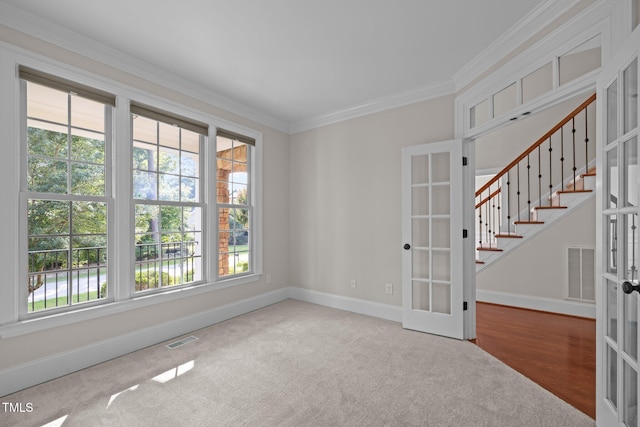 3005 Canopy Woods Dr, Apex, NC 27539 - unfurnished room featuring french doors, healthy amount of natural light, ornamental molding, and carpet floors