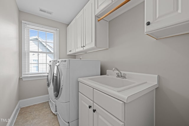 3005 Canopy Woods Dr, Apex, NC 27539 - washroom featuring cabinet space, washing machine and dryer, plenty of natural light, and light tile patterned flooring