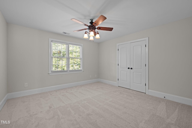 3005 Canopy Woods Dr, Apex, NC 27539 - unfurnished bedroom featuring carpet flooring, a closet, and a ceiling fan