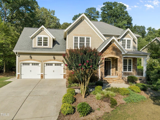 3005 Canopy Woods Dr, Apex, NC 27539 - craftsman-style house with stone siding, driveway, a porch, and roof with shingles
