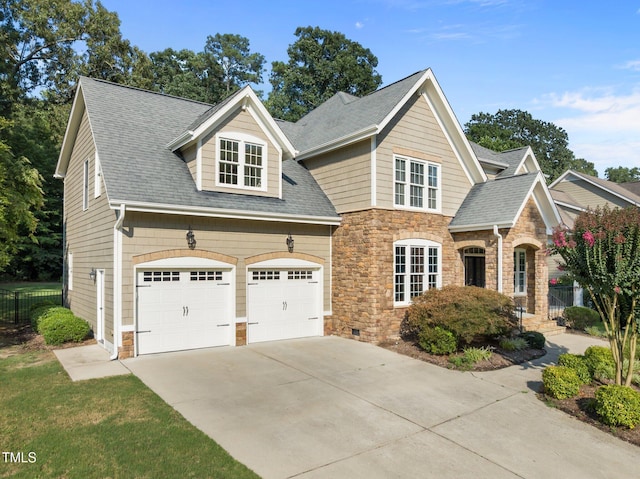 3005 Canopy Woods Dr, Apex, NC 27539 - view of front of home featuring stone siding, driveway, roof with shingles, and an attached garage