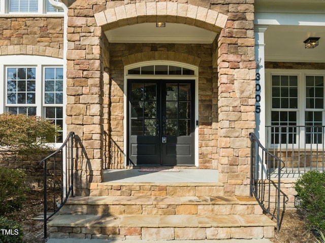 3005 Canopy Woods Dr, Apex, NC 27539 - entrance to property featuring french doors and stone siding