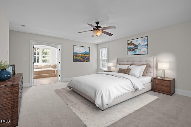 3005 Canopy Woods Dr, Apex, NC 27539 - bedroom featuring light colored carpet, ensuite bath, and a ceiling fan