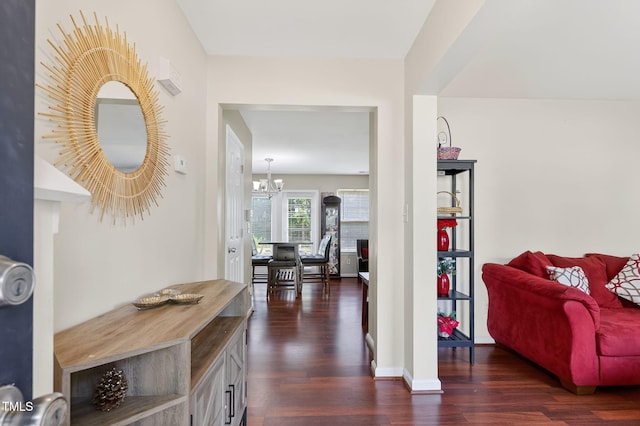 4017 Rothfield Ln, Raleigh, NC 27616 - corridor featuring a chandelier and dark wood-type flooring
