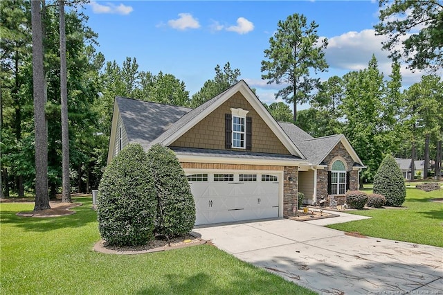 72 Orchard Falls Dr, Spring Lake, NC 28390 - craftsman house featuring concrete driveway, stone siding, a garage, a front lawn, and roof with shingles