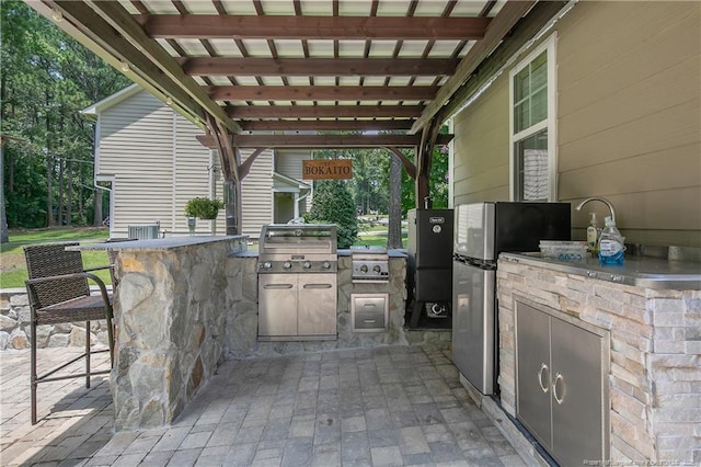 72 Orchard Falls Dr, Spring Lake, NC 28390 - view of patio featuring exterior kitchen and a pergola