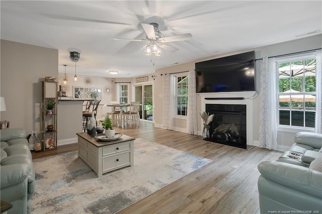 72 Orchard Falls Dr, Spring Lake, NC 28390 - living area featuring a ceiling fan, healthy amount of natural light, and light wood-type flooring