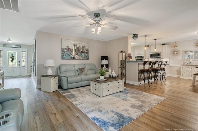 72 Orchard Falls Dr, Spring Lake, NC 28390 - living room featuring ceiling fan and light wood-style flooring