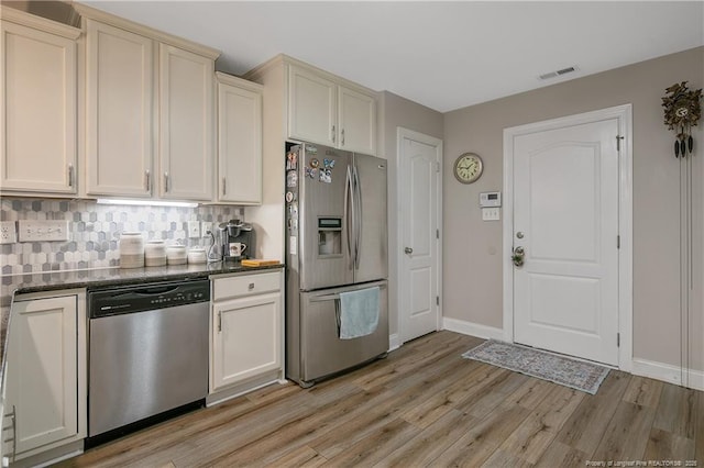 72 Orchard Falls Dr, Spring Lake, NC 28390 - kitchen with stainless steel appliances, light wood finished floors, and backsplash