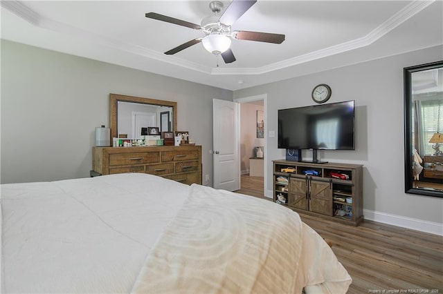 72 Orchard Falls Dr, Spring Lake, NC 28390 - bedroom with wood finished floors, crown molding, a tray ceiling, and a ceiling fan