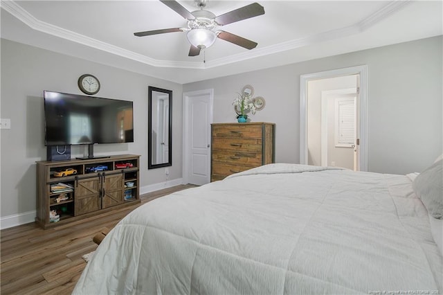 72 Orchard Falls Dr, Spring Lake, NC 28390 - bedroom with wood finished floors, crown molding, a tray ceiling, and ceiling fan