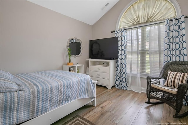 72 Orchard Falls Dr, Spring Lake, NC 28390 - bedroom with lofted ceiling and wood finished floors