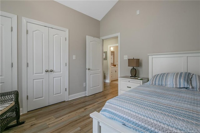 72 Orchard Falls Dr, Spring Lake, NC 28390 - bedroom with light wood-style flooring and high vaulted ceiling