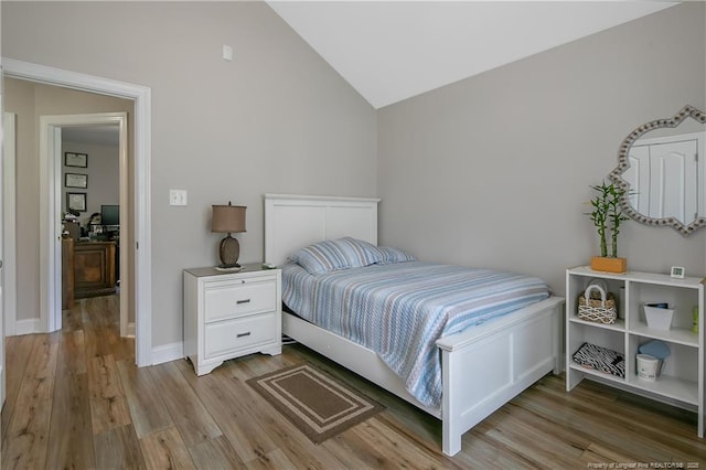 72 Orchard Falls Dr, Spring Lake, NC 28390 - bedroom featuring vaulted ceiling and light wood-type flooring