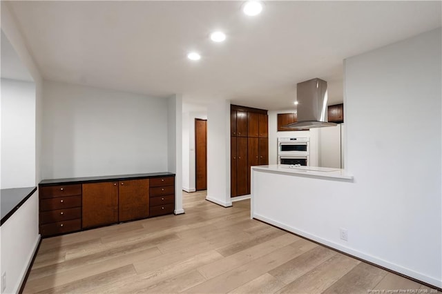 916 Rays Bridge Rd, Whispering Pines, NC 28327 - unfurnished living room featuring light wood-style floors and recessed lighting