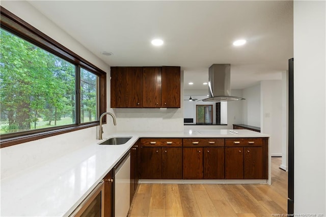 916 Rays Bridge Rd, Whispering Pines, NC 28327 - kitchen featuring island range hood, light countertops, light wood-style floors, and recessed lighting