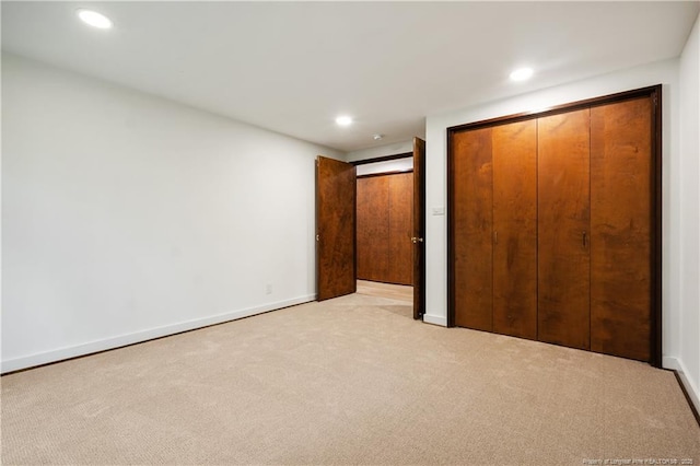 916 Rays Bridge Rd, Whispering Pines, NC 28327 - unfurnished bedroom featuring light carpet, recessed lighting, and a closet