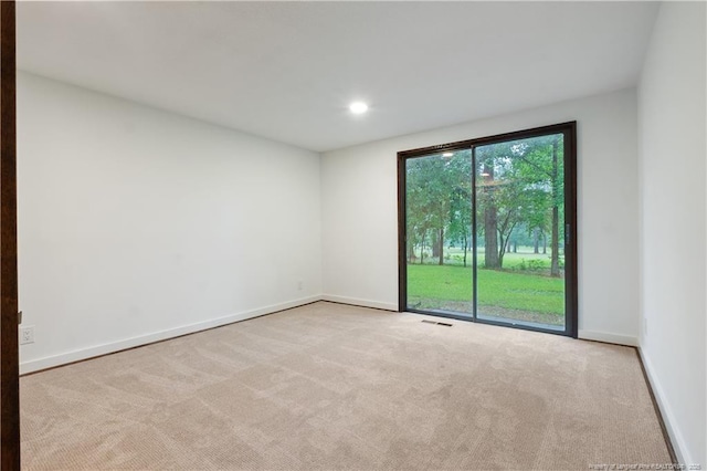 916 Rays Bridge Rd, Whispering Pines, NC 28327 - carpeted empty room featuring baseboards and recessed lighting