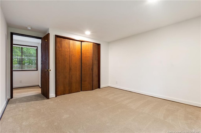916 Rays Bridge Rd, Whispering Pines, NC 28327 - unfurnished bedroom featuring light carpet, recessed lighting, and a closet